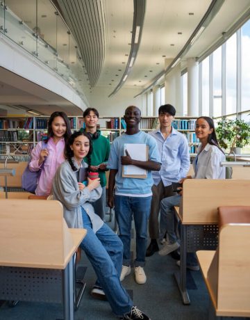 full-shot-smiley-students-library